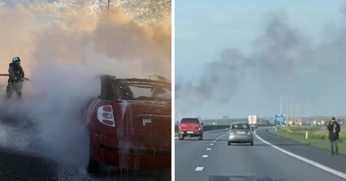 Auto staat brandend op de pechstrook op E40, bestuurder wandelt rustig
