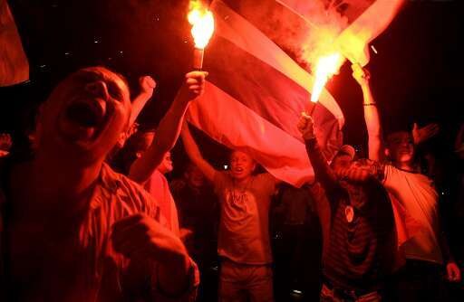 Rellen in Delft en Basel na uitschakeling Oranje | De Morgen